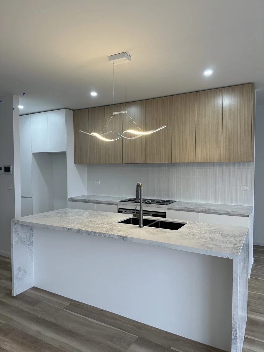 Kitchen stone and cabinetry by Pristine Renovations